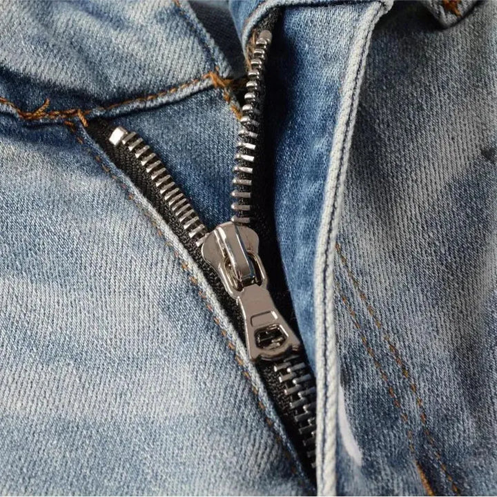 Tight men's frayed jeans